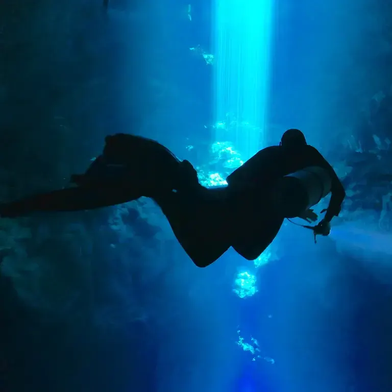 TDI tec sidemount diver in the cenotes of Mexico